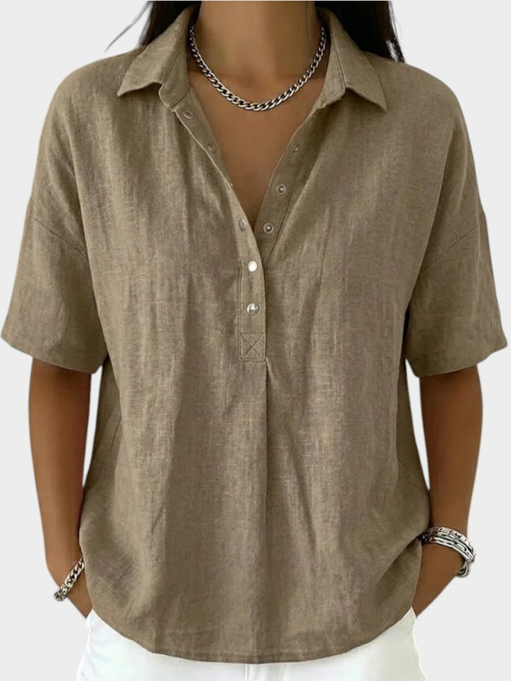 Victoria Boutique Adèle beige cotton blend blouse with collar, V-neck, and front button detail on a model
