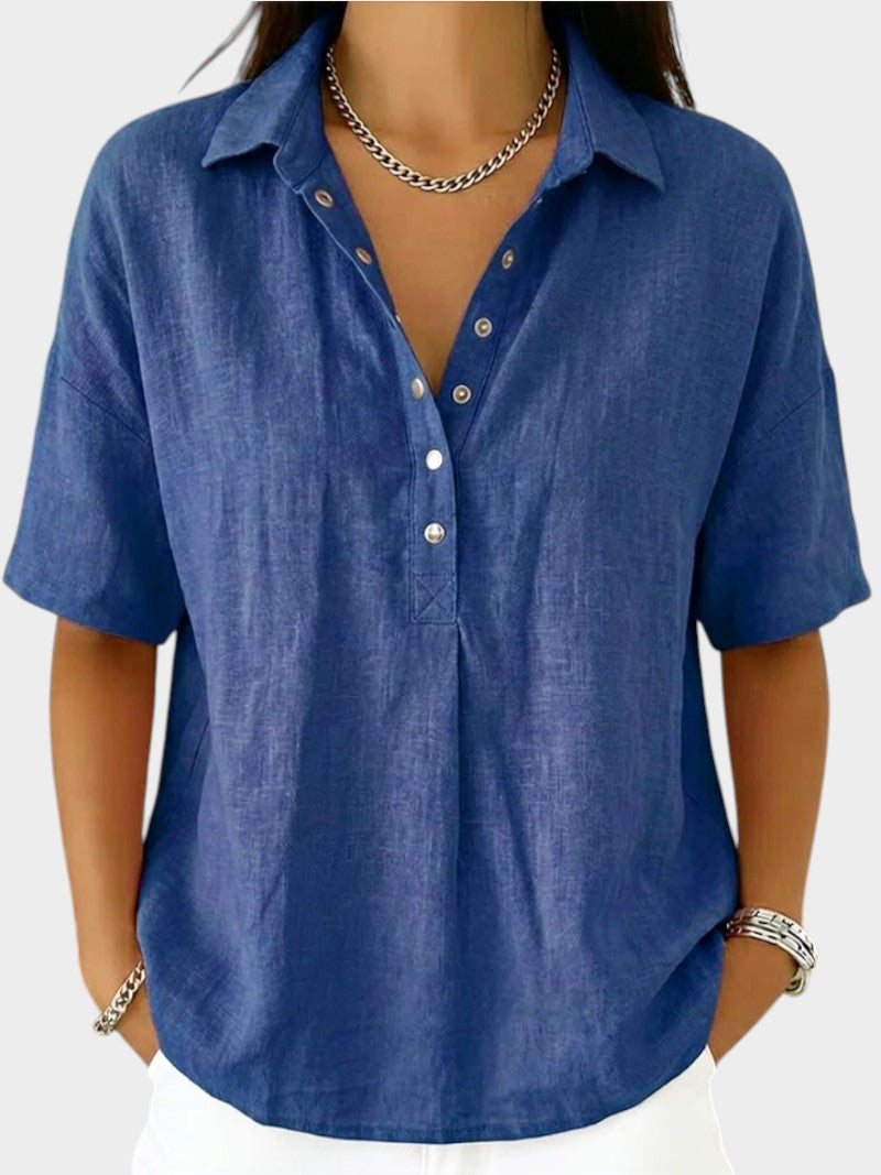 Victoria Boutique Adèle blue cotton blend blouse with collar, V-neck, and front button detail on a model