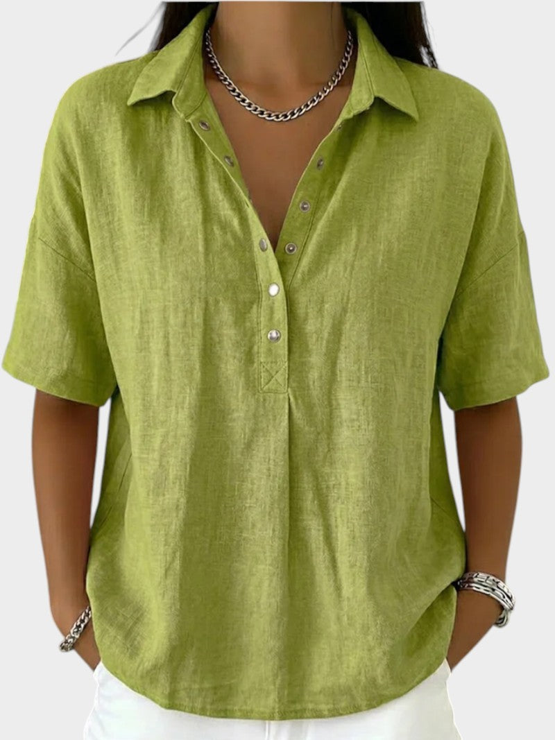 Victoria Boutique Adèle green cotton blend blouse with collar, V-neck, and front button detail on a model