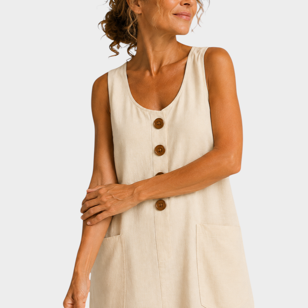 Victoria Boutique beige cotton linen summer dress with U-neckline, decorative buttons, and side pockets.