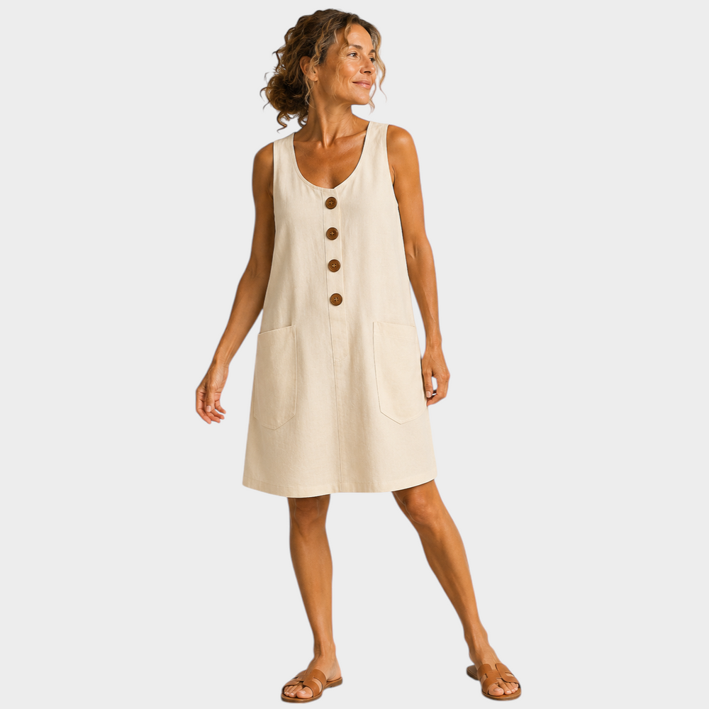Victoria Boutique beige cotton linen summer dress with U-neckline, decorative buttons, and side pockets on a woman