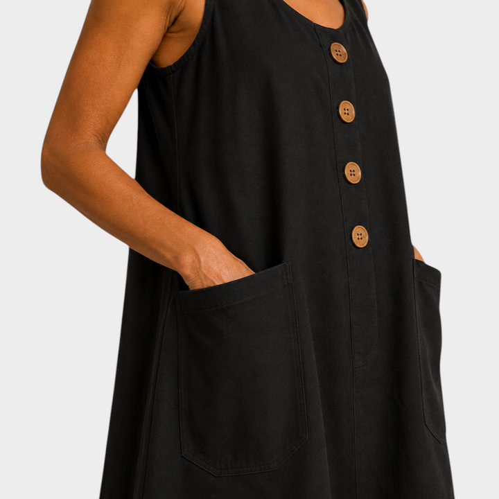 Victoria Boutique black cotton linen summer dress with decorative buttons and side pockets on a model