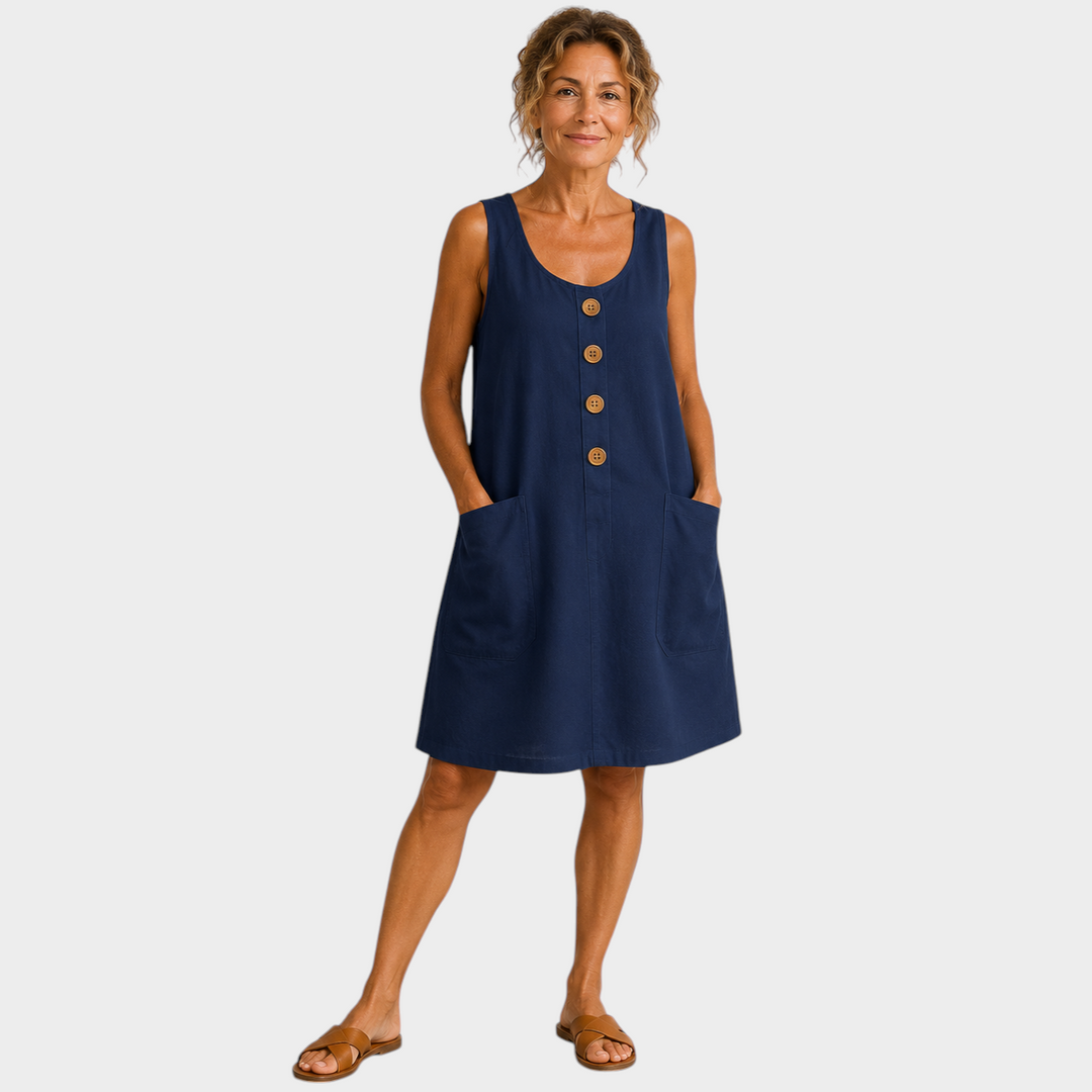 Victoria Boutique navy blue cotton linen summer dress with U-neckline, decorative buttons, and side pockets on a model