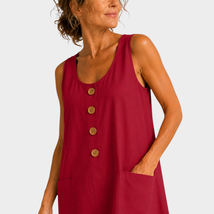 Victoria Boutique Riley red cotton linen summer dress with U-neckline, decorative buttons, and side pockets on a model