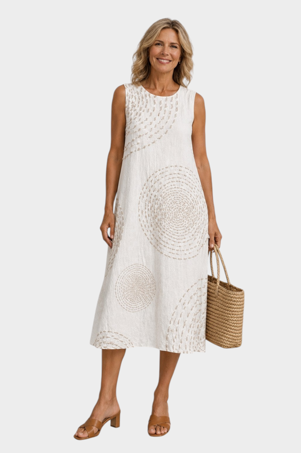Victoria Boutique Selena sleeveless midi dress in white with beige circular print, featuring side pockets and a relaxed fit.